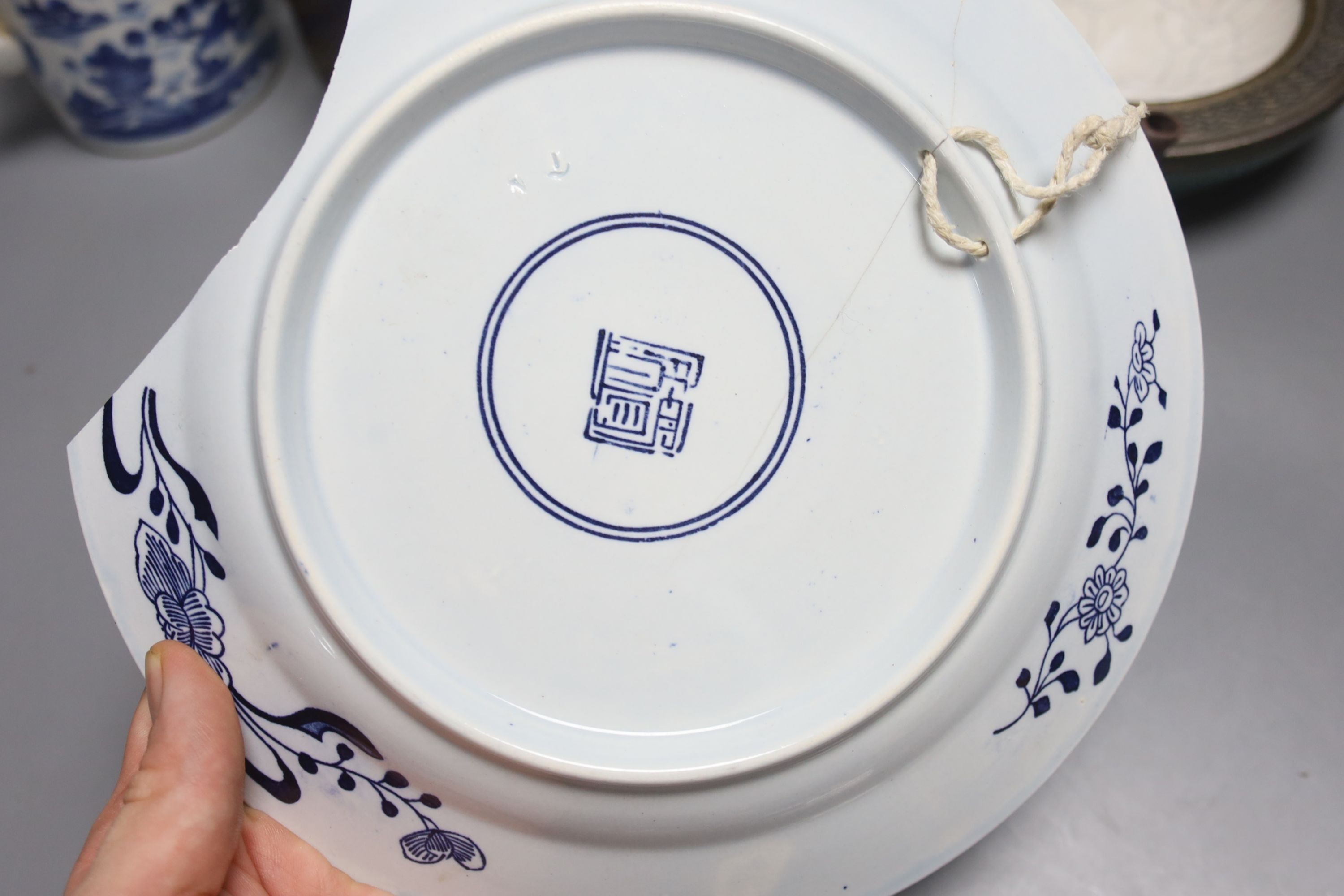 A Chinese Yixing teapot, similar blue and white teapot, blue and white dish and a candle holder, blue and white tea pot 14 cms high.